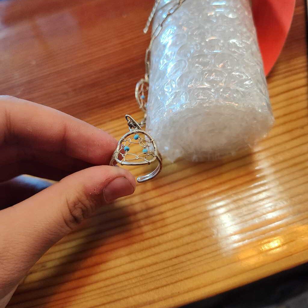 Bracelet and attached ring