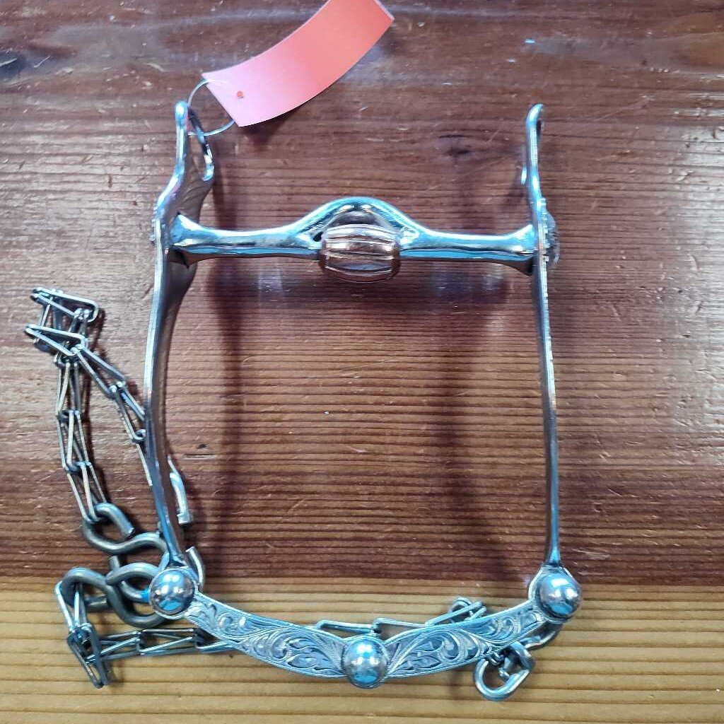 Correction bit with port and roller