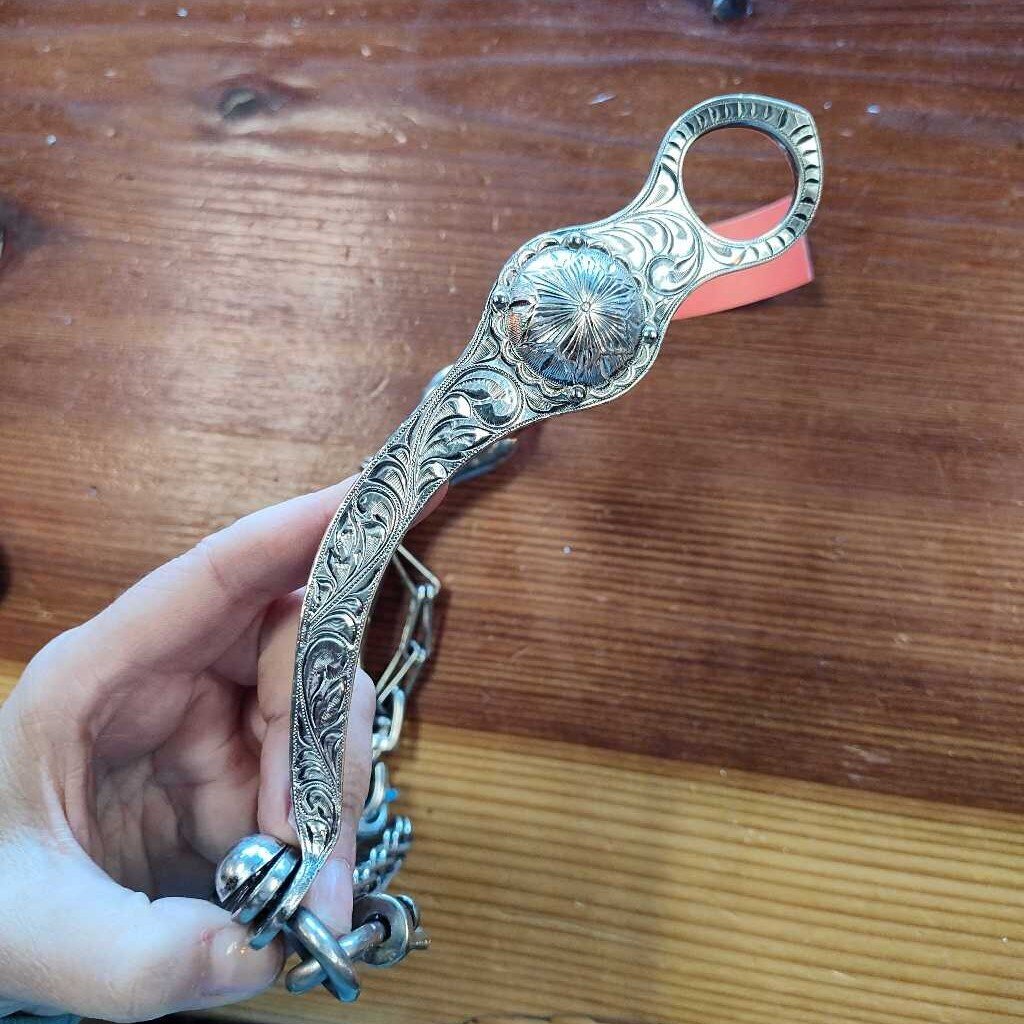 Correction bit with port and roller