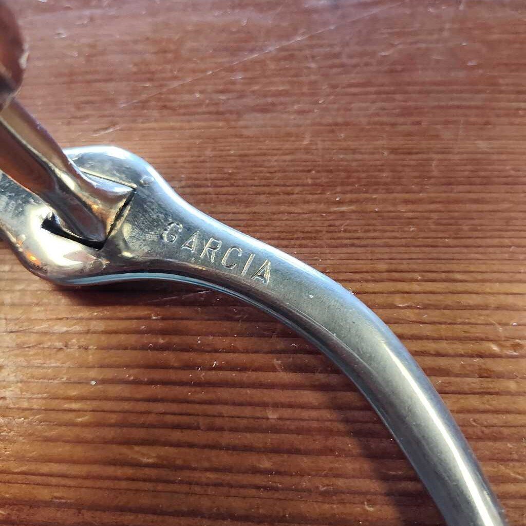Correction bit with port and roller