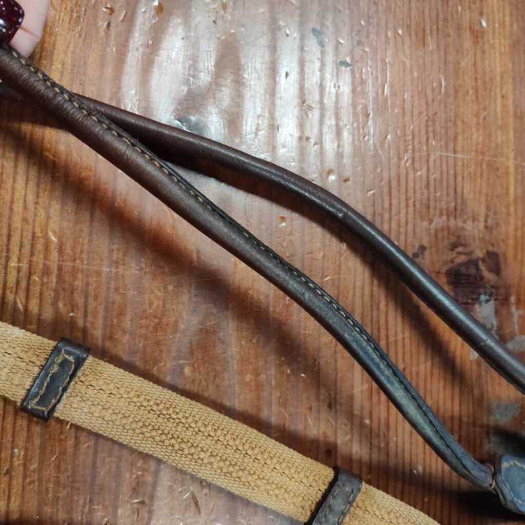 Rolled leather with webbing and grips