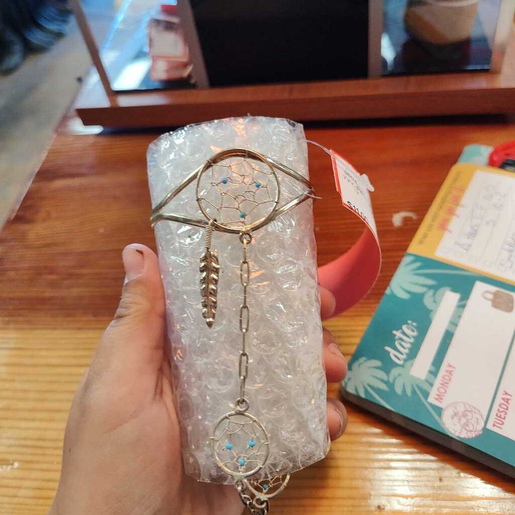 Bracelet and attached ring