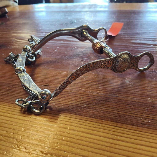 Correction bit with port and roller