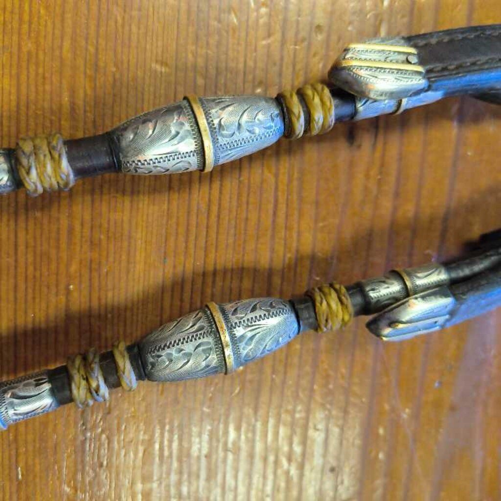 Single ear, Sterling silver and rawhide detail