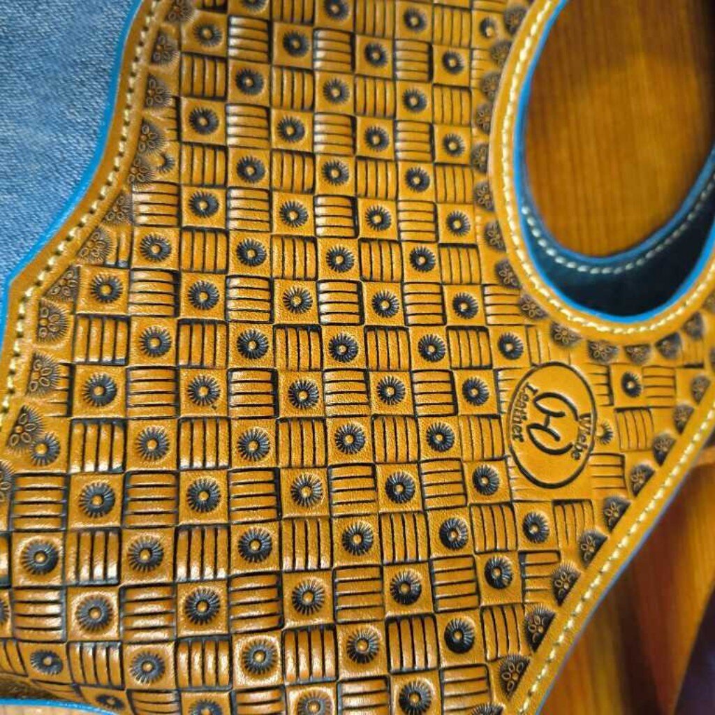 Jean and leather tooled