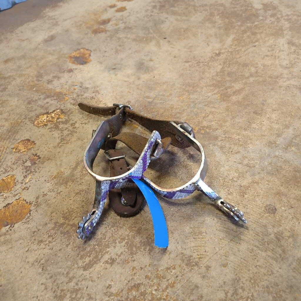 Spurs and straps-bling